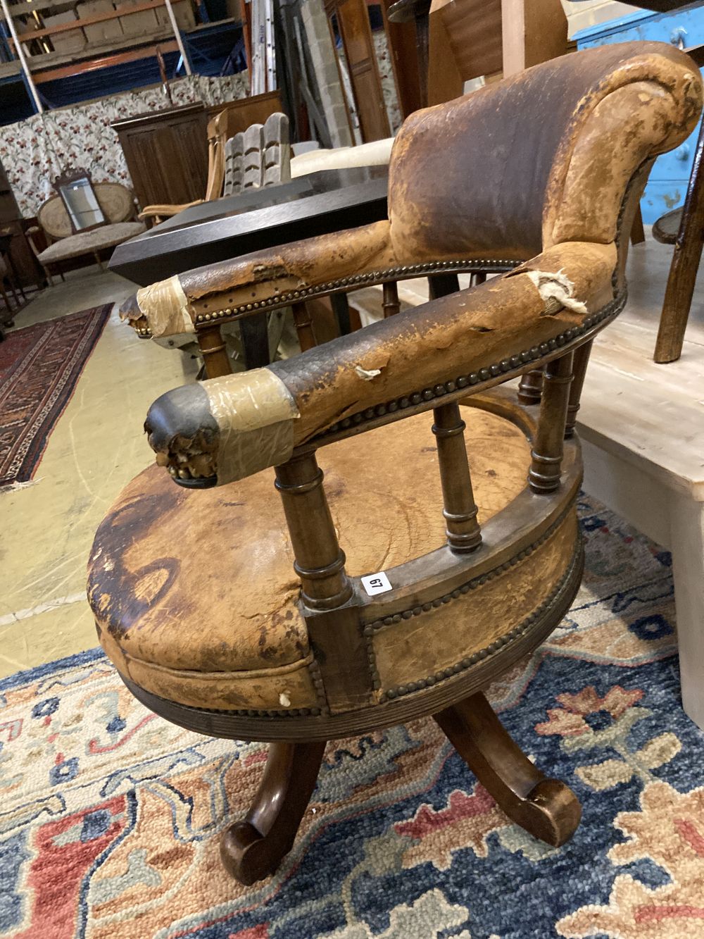 A Victorian leather upholstered mahogany swivel desk chair